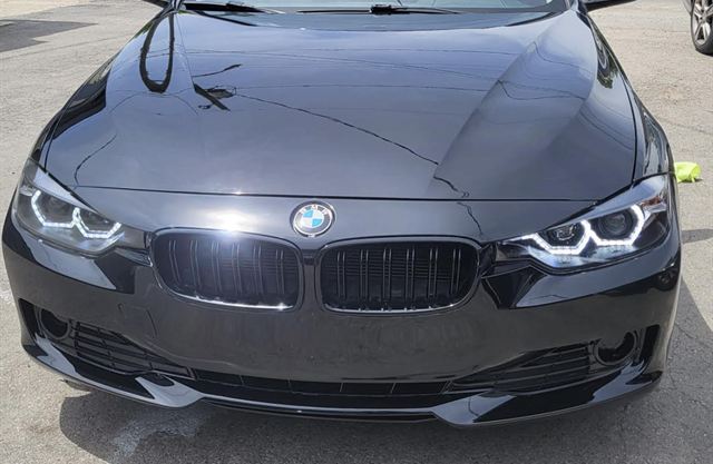 Front end of a black BMW sedan