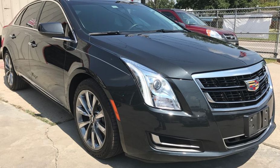 Dark gray Cadillac sedan, front three-quarter view