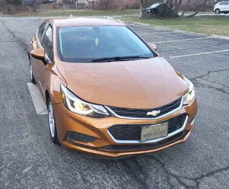 Orange Chevrolet hatchback, front view